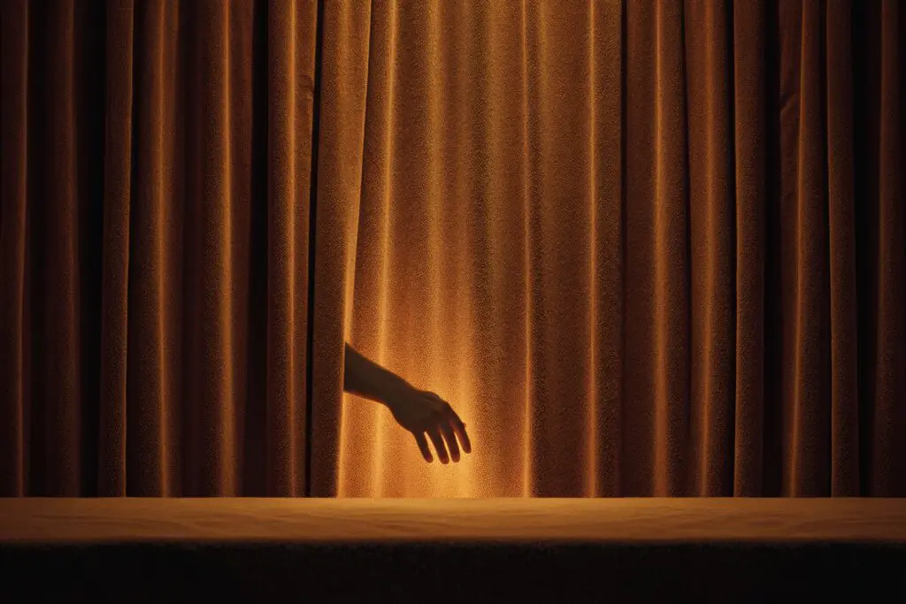 A curtain being drawn in front of a profile a metaphor for the FAQ on how to pause Hinge