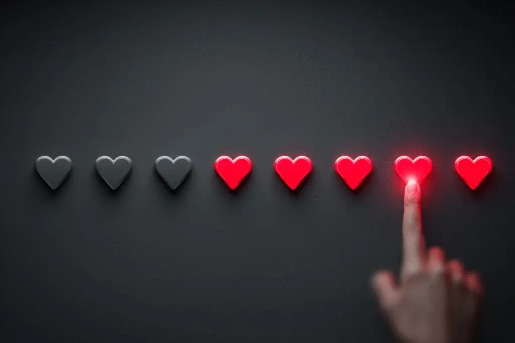 A hand refilling a row of hearts a visual guide for the FAQ on when do Hinge likes reset