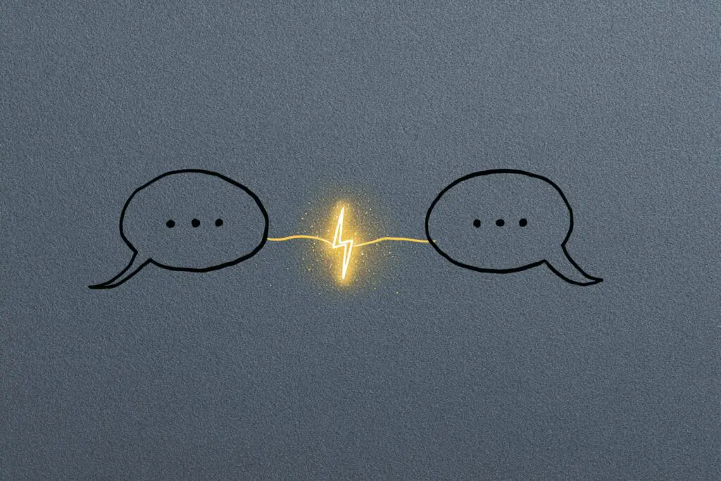 A spark between two speech bubbles illustrating the answer to the FAQ on how to flirt on Hinge - Dating Man Secrets - Psychology Attraction Tips Revealed A spark between two speech bubbles illustrating the answer to the FAQ on how to flirt on Hinge