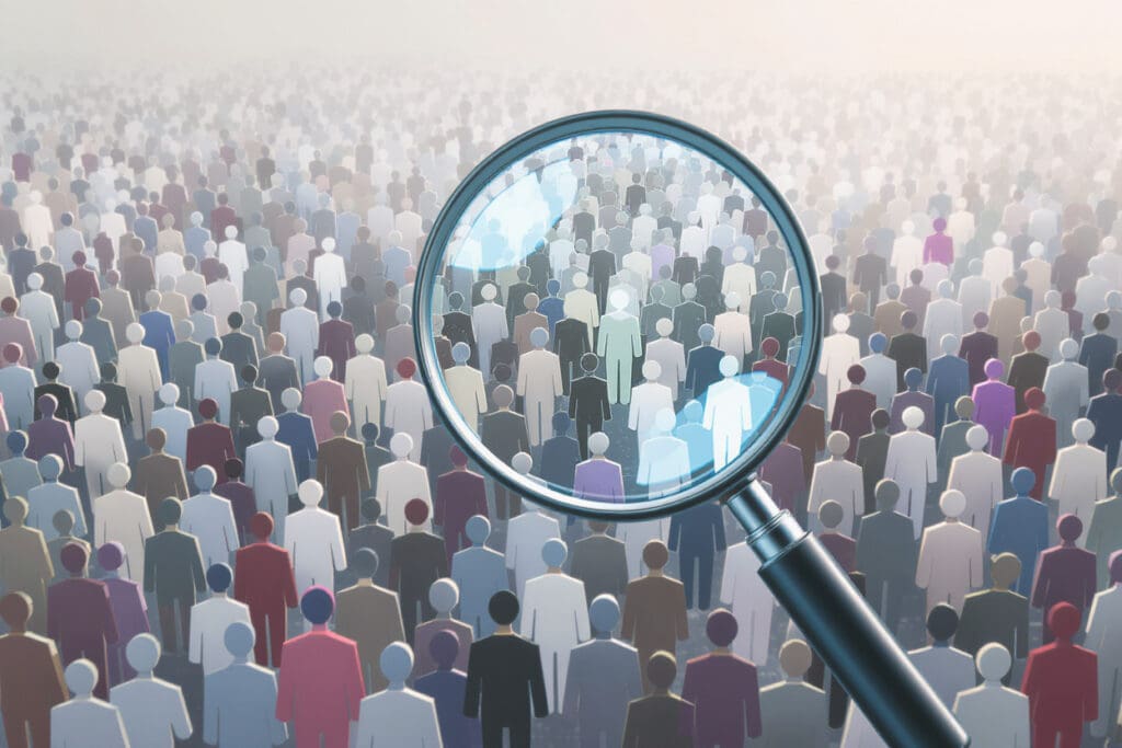 a magnifying glass focusing on one person in a crowd illustrating how to find someone on bumble